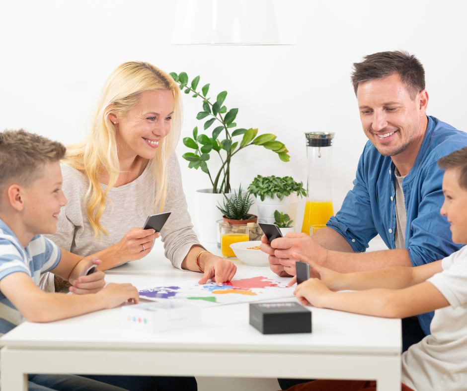 Family playing math activity for game night, beat the summer slide